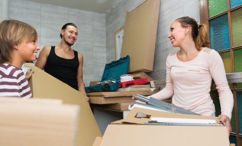 Moving van and packed boxes outside a Lewisham home