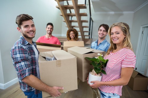 Moving boxes and furniture prepared for a home move in Lewisham