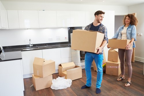 Furniture and boxes being moved from a Lewisham flat