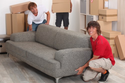 Local movers transporting belongings through a Lewisham street