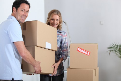 Removalists moving furniture through a Lewisham terrace house