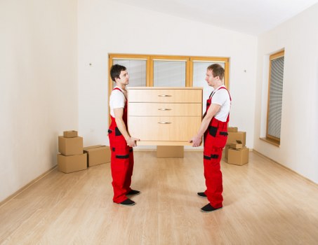 Professional movers handling office furniture during a Lewisham relocation