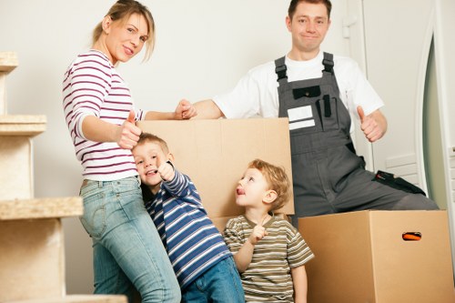 Professional movers handling boxes during Lewisham flat removals